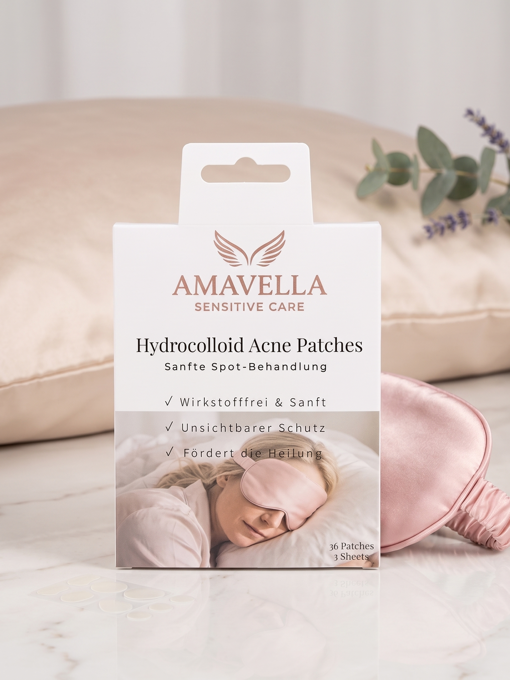 Vorderseite der Amavella Hydrocolloid Acne Patches Verpackung auf einem Bett mit Schlafmaske.